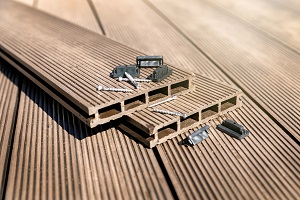 decking board of composite from plastics and wood viewed in profile