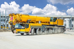 yellow heavy duty crane on an industrial ground