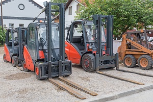various forklift trucks on a parking area