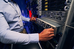 server module assebled to a rack by a man in a shirt