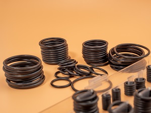 many black seal rings of different size on stacks