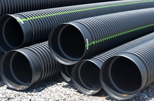 a few flexible plastic pipes for drainage systems in anthracite