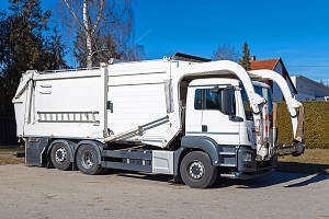 waste collection vehicle with forklift for front loading